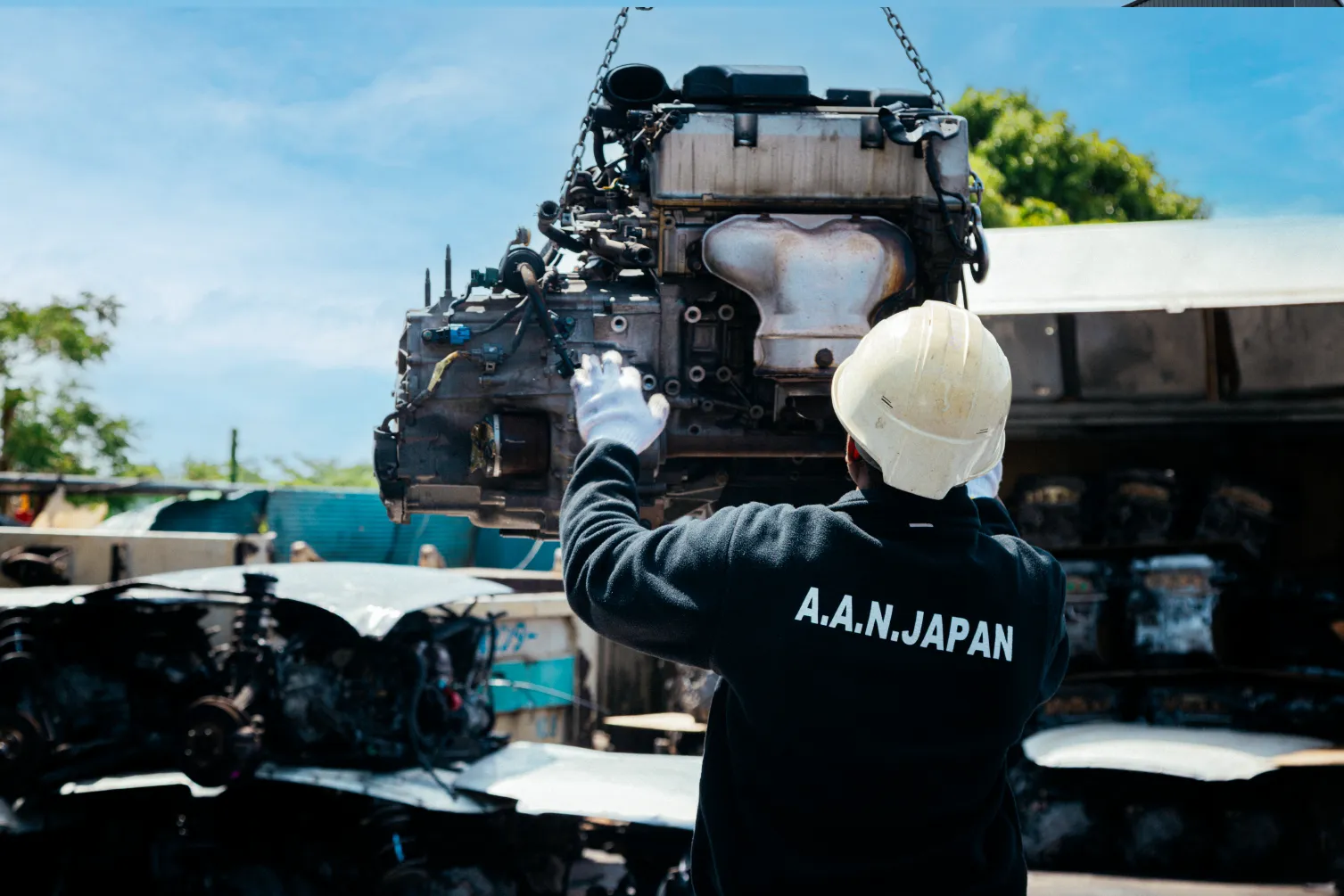 AAN Japan employee handling engine parts